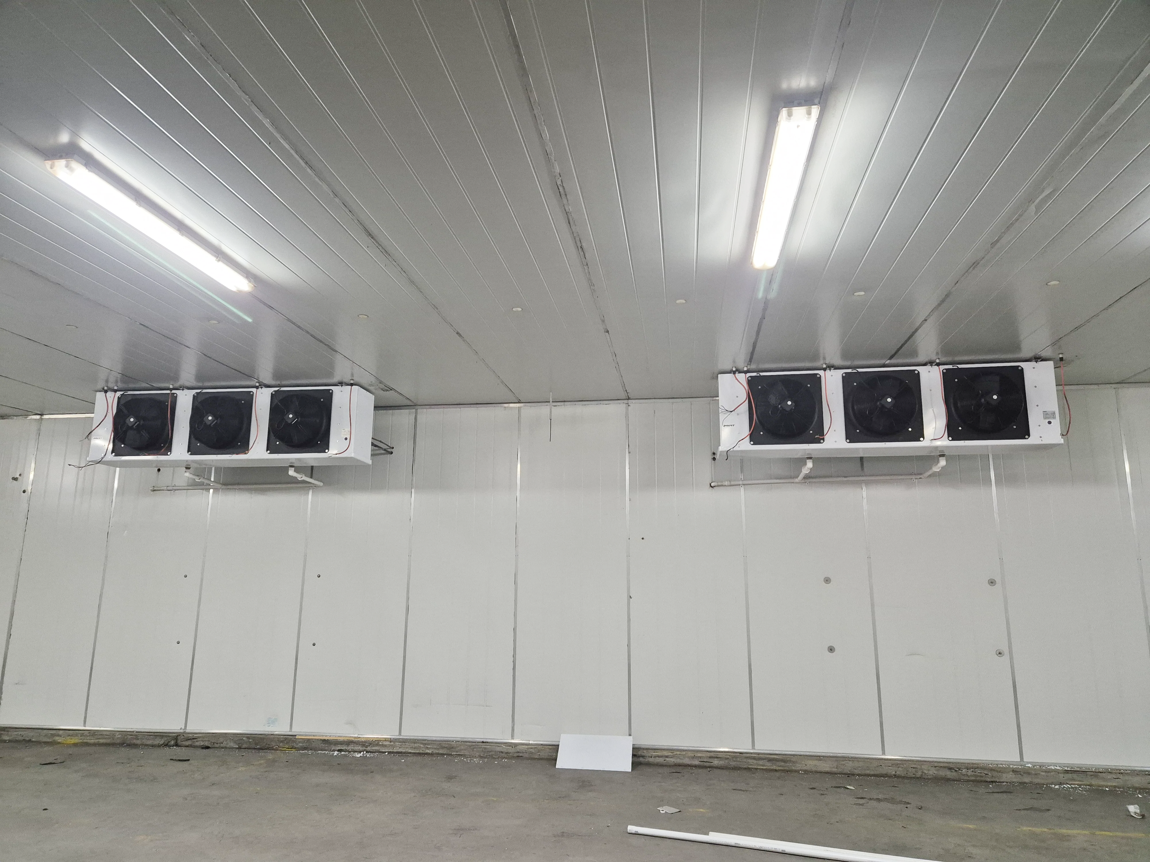 Cold room interior with refrigeration units on the ceiling